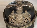 a black and gold helmet with a crown on it