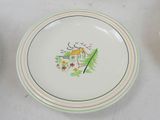a white plate with a picture of a house on it