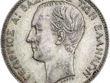 Gros plan sur une pièce de monnaie portant le visage d'un homme