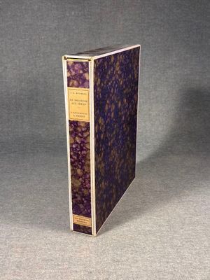 an old book sitting on top of a table next to a gray background