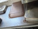 several pans and pans are sitting on a counter in a kitchen
