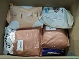 a cardboard box filled with bags of dog food