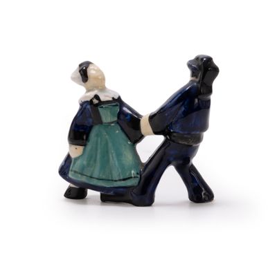 a figurine of a man and a woman holding hands