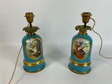 pair of blue and gold vases with flowers and birds painted on them
