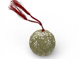 une boule verte à laquelle est attachée une ficelle rouge