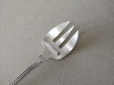 a fork that is sitting on a table next to a knife