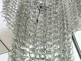 a large metal sculpture of a man made out of wire