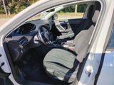 the interior of a car with the driver ' s seat folded down