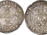 a silver coin with a crown on top of it