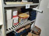 a closet with a lot of files and boxes on the shelves