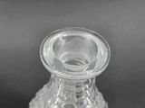 a clear glass vase with a clear top on a table