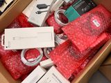 a box full of electronic items sitting on a table