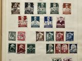 an open book with a bunch of stamps on it