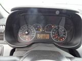 a close up of a car dashboard with various gauges