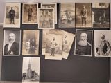 several old black and white photographs of men and women on a wall