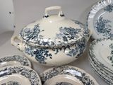 many plates and bowls that are sitting on a table
