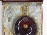 a bottle of liquor sitting in a box on a table