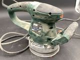 a picture of a sander with a cord attached to it