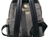 a small backpack with a stuffed animal inside of it