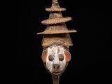 a close up of a sculpture of a skull on a stand