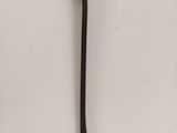 a black toothbrush and a black toothbrush on a white surface