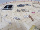 many different types of jewelry on the table