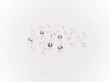 a bunch of white diamonds on a white surface