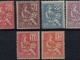 a group of stamps with different colors on them on a black surface