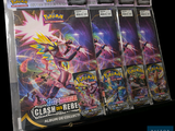 four packs of pokemon cards on display in a store