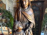 a statue of a woman holding a child in her arms