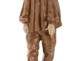 figurine of a man with a hat and jacket standing on a base