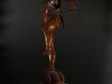 an antique bronze statue of an angel on a pedestal
