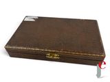 a small brown box with a handle on a white surface