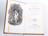 an open book with a picture of a man and a woman in a garden