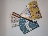a lot of stamps and envelopes sitting on a table