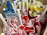 a basket full of pens and other items in it