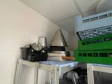 a small kitchen with a stove, microwave, and other appliances