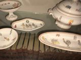 many plates and bowls on a glass table