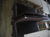 a stack of black refrigerators stacked on top of each other