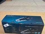 the box of a hair dryer is sitting on the floor