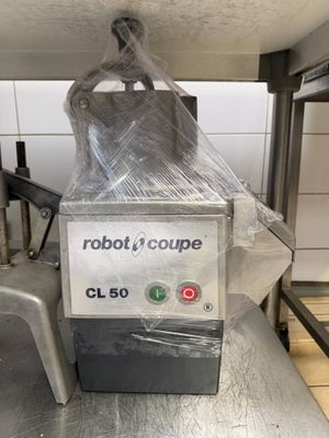 a robot that is sitting on a conveyor belt