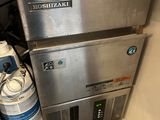a machine that is sitting next to a bottle of water
