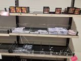 a lot of makeup products on the shelves in the store