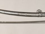 two swords that are on display on the wall