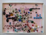 a picture of a pink tray filled with buttons and beads