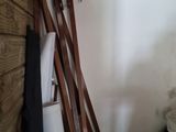 several pieces of wood are stacked on top of each other in a room
