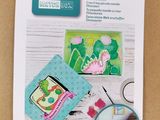 a close up of a craft kit with a picture of a dinosaur on it
