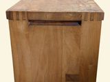 a wooden table with a drawer on top of it
