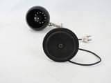 a black object that is sitting on a white surface