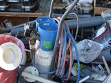 a pile of assorted items in a garage